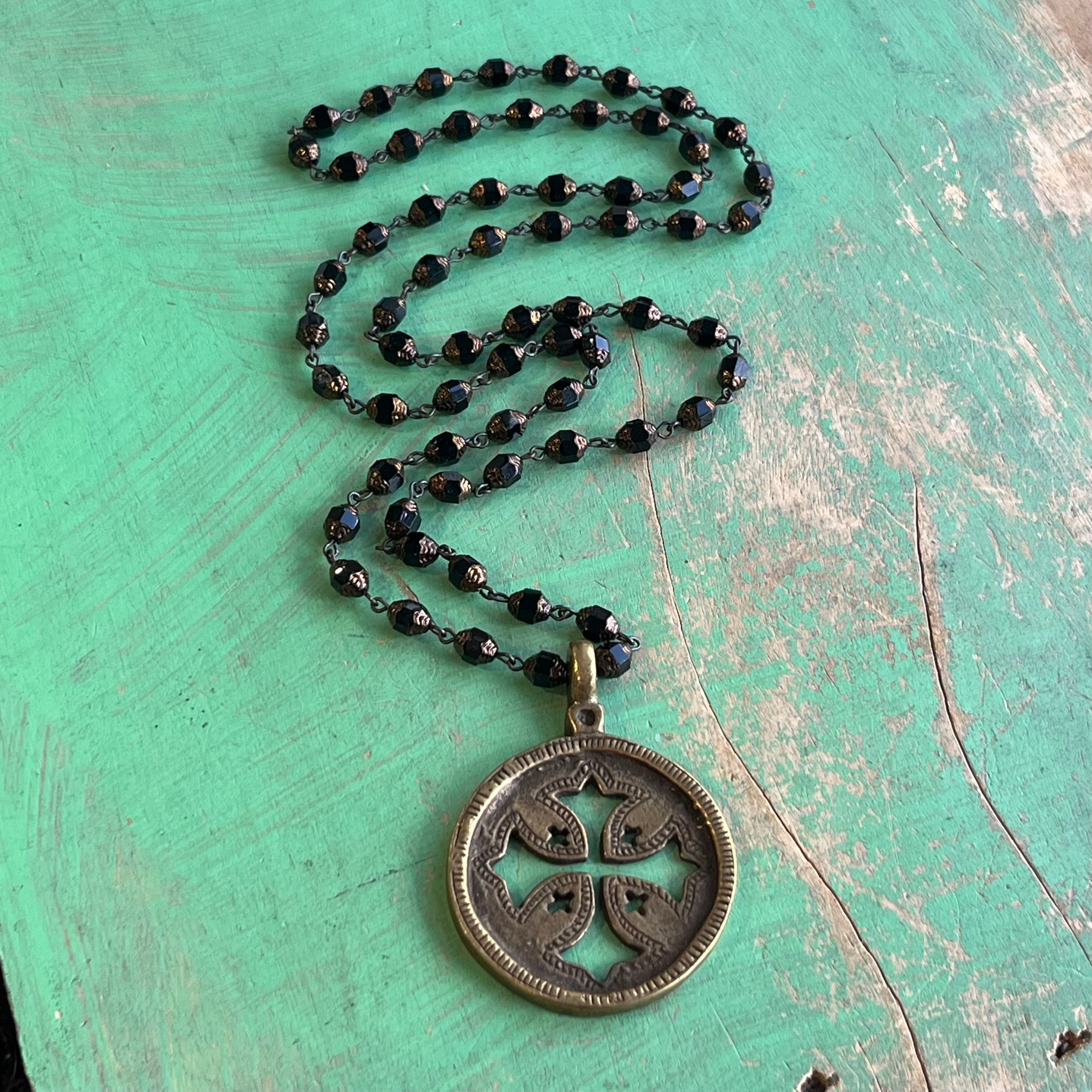 Black and Brass Long Cut Out Cross Necklace