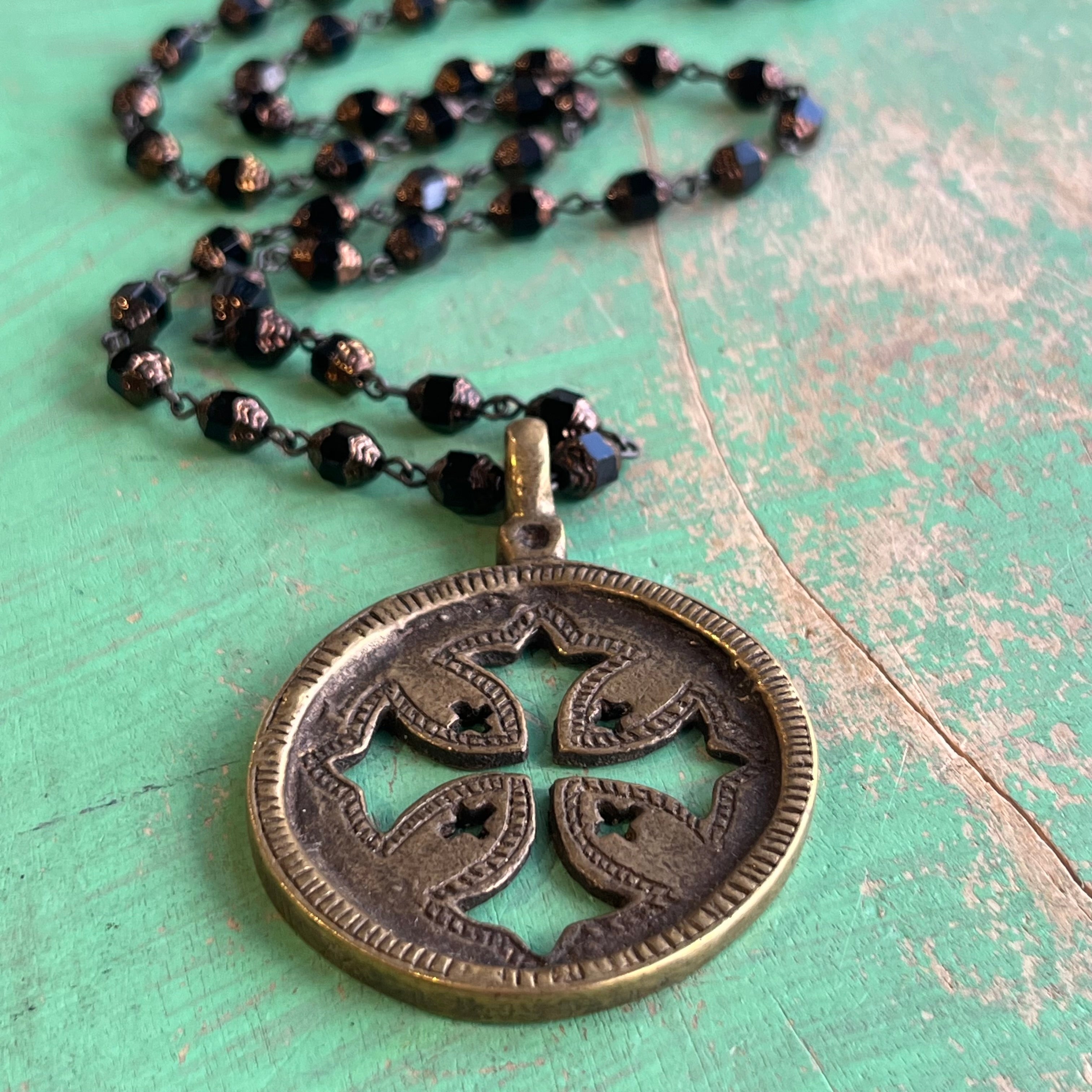 Black and Brass Long Cut Out Cross Necklace